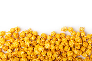 Delicious caramel popcorn isolated on white background. Cinema and entertainment concept. Movie night with popcorn. Cheese and caramel popcorn. Delicious appetizer, snack. Banner