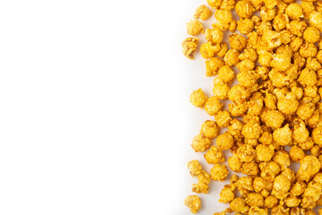 Delicious caramel popcorn isolated on white background. Cinema and entertainment concept. Movie night with popcorn. Cheese and caramel popcorn. Delicious appetizer, snack. Banner