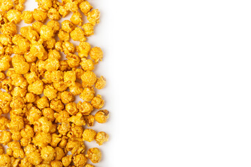 Fototapeta premium Delicious caramel popcorn isolated on white background. Cinema and entertainment concept. Movie night with popcorn. Cheese and caramel popcorn. Delicious appetizer, snack. Banner