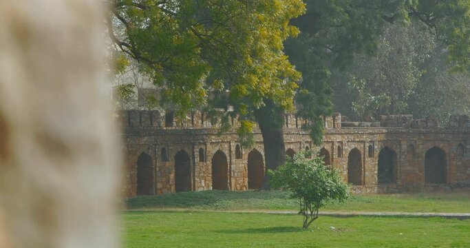 New Delhi, Delhi, India. Old wall surrounded Isa Khan's Tomb near The Humayun's tomb. Famous place is Tomb of Mughal emperor, Mirza Nasir al-Din Muhammad commonly known as Humayun situated in Delhi