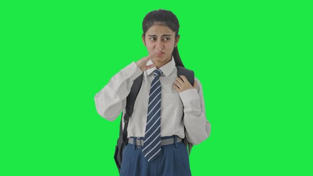 Indian school girl disgusted by bad smell Green screen