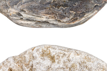 Edges of two pebbles isolated on white background