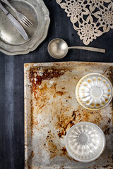 Various old kitchen objects on black chalkboard background