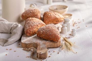 Brown and tasty triangular buns baked in a bakehouse.