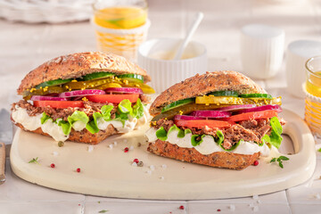 Tasty sandwich with pulled beef, tomato and lettuce.