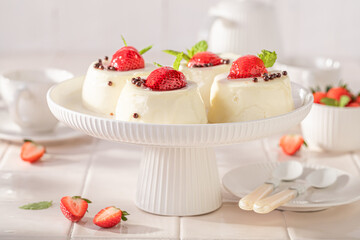 Sweet cheesecake monoportion with strawberries and vanilla glazed.