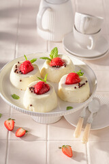 Homemade cheesecake monoportion with strawberry mousse and vanilla.