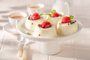 Delicious cheesecake monoportion made with berries and sprinkles.