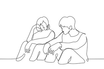 woman and man sit side by side on the floor or ground resting their outstretched arms on their knees - one line art vector. concept of friends talking, waiting together, couple together