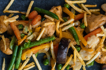 Salad with vegetables, meat and French fries