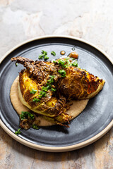 Roasted savoy cabbge wedges on white bean puree