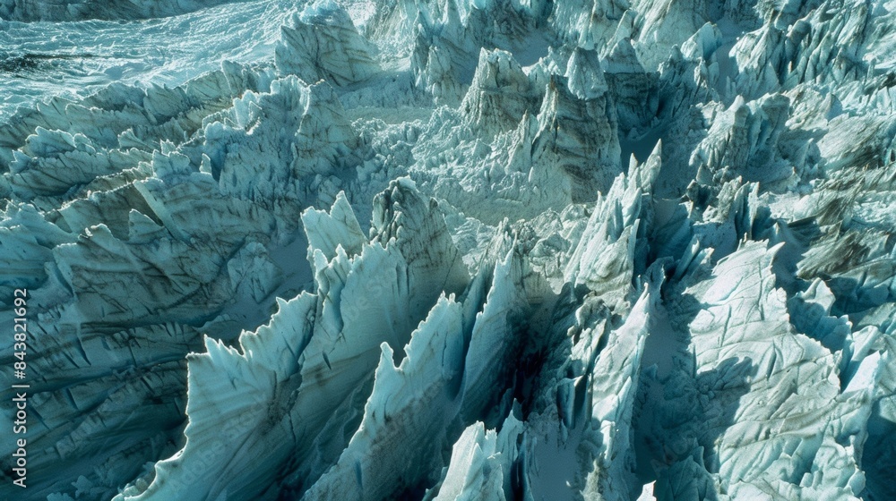 Aufkleber a majestic glacier with rows upon rows of sharp penitente formations piercing through the surface.