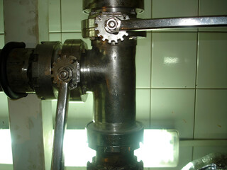 Stainless steel taps in food production facility, sanitation and hygiene standards in industry