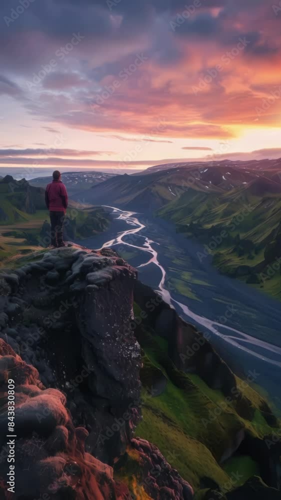 Wall mural Person is standing on mountain top