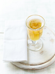 Glass of beer on bright wooden background. Copy space.	