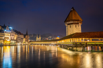 Fototapeta premium Night view of chapel bridge ,jesuitenkirche in old town are very famous and beautiful landscape in Luzern Switzerland 