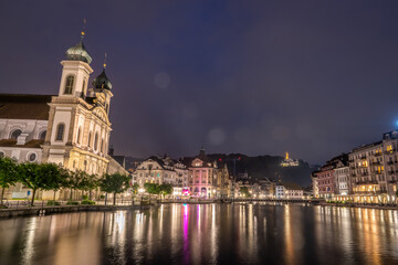 Obraz premium Night view of chapel bridge ,jesuitenkirche in old town are very famous and beautiful landscape in Luzern Switzerland 