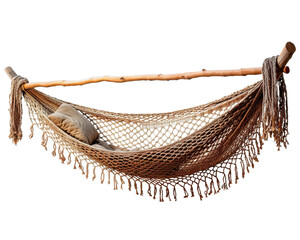 Obraz premium A hammock with fringe hangs between two wooden posts. A pillow sits inside the hammock.