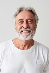 Obraz premium Elderly man with gray hair, happy expression, casual white t-shirt, white background, room for text
