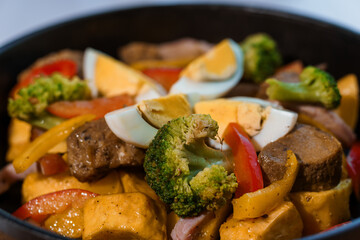 Stewed meat with vegetables and mushrooms
