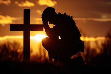 The silhouette of a soldier kneeling before a battlefield cross, surrounded by the quiet solitude of a setting sun.