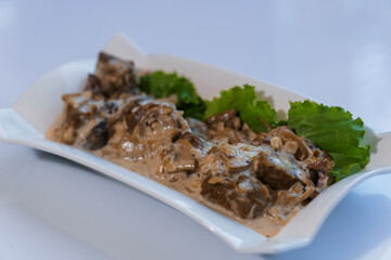 Stewed meat with vegetables and mushrooms