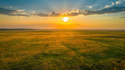 Obraz premium Sunset over a vast prairie landscape img
