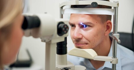 Optometrist, patient and assessment in clinic for eye exam, vision and optometry with...