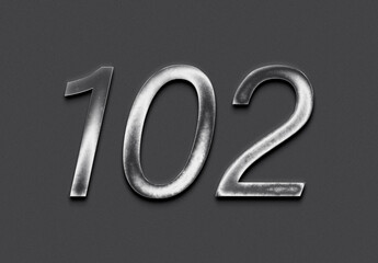 Chrome metal 3D number design of 102 on grey background.