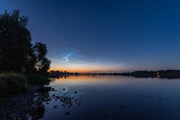Noctilucent clouds over the Daugava river in Latvia on June night