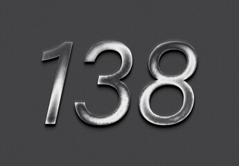 Chrome metal 3D number design of 138 on grey background.