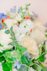 A close-up of springtime wedding bouquet with greens and white flowers