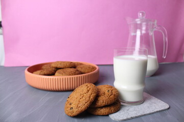 oatmeal cookies milk breakfast cookies with milkon a pink background space for text copyspace