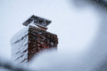 snow on a chimney of the roof in the winter © Jay
