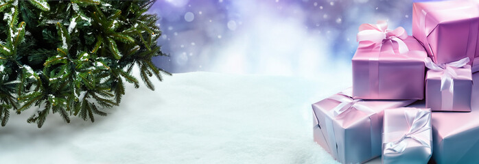 Winter background, Christmas tree and presents on a snow background