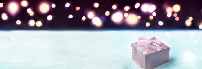 Silk box on a winter background with twinkling lights, foot prints in the snow