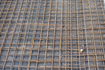 Rebar lying on the foundation of a building