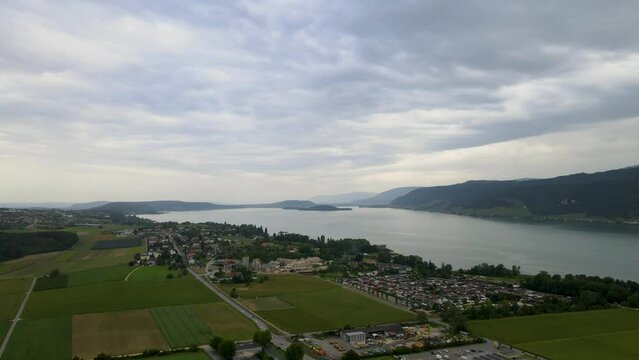 Lake of Biel aerial shot during cloudy weather; Lake in Central Europe, surrounded by small villages