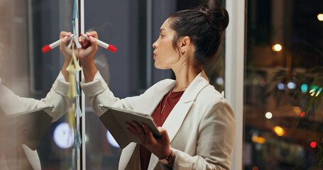 Night, business and woman with tablet, glass wall and writing with research for proposal, thinking...