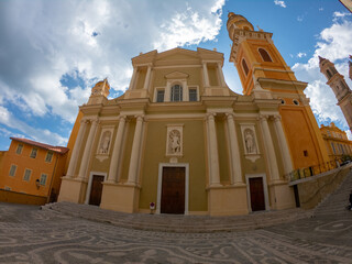 The Basilica of Saint-Michael the Archangel in Menton, France. The tall bell tower on the right...