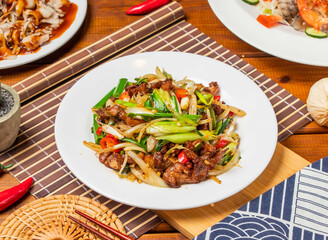 Taiwan Salted pork noodles with garlic sprouts with chopsticks served in dish isolated on table side view taiwanese food