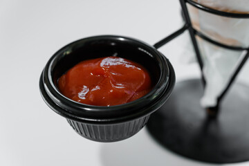 French fries with ketchup on a stand