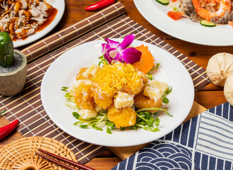 Pineapple Shrimp Balls with chopsticks served in dish isolated on table side view taiwanese food