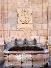 Fountain of the Cathedral. Stone baroque fountain with three pipes in Siguenza. Sigüenza, province...