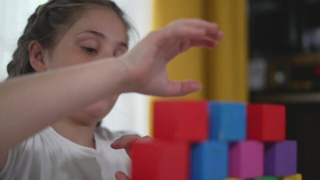 Happy child at kindergarten with constructor blocks building skillfully. Joy constructive play learning with shapes and colors. Cheerful kindergarten moments child play with constructor. child dream.