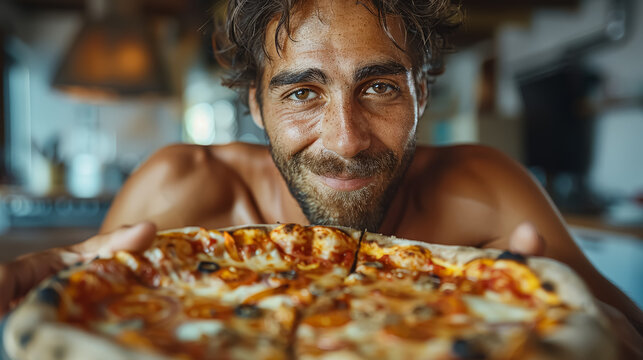 A man is holding a pizza in his hands and smiling. The pizza is covered in cheese and toppings, and it looks delicious. The man seems to be enjoying the pizza and is happy to share it with others
