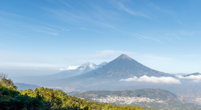 Volcanos agua acatenango and fuego in guatemala during a sunny day seen from pacaya