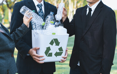 Cleaning day concept, corporate volunteer with eco business people cleaning forest with waste...