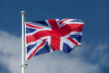 The flag of the United Kingdom waving in mid air
