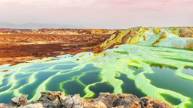 Colorful green volcanic lake terraces and yellow sulphur minerals, Danakil Depression desert, Afar region, Ethiopia